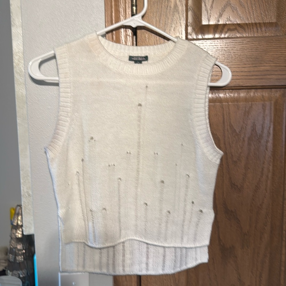 White top wore mostly as a swimsuit cover up